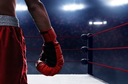 Boxer wearing gloves entering the ring